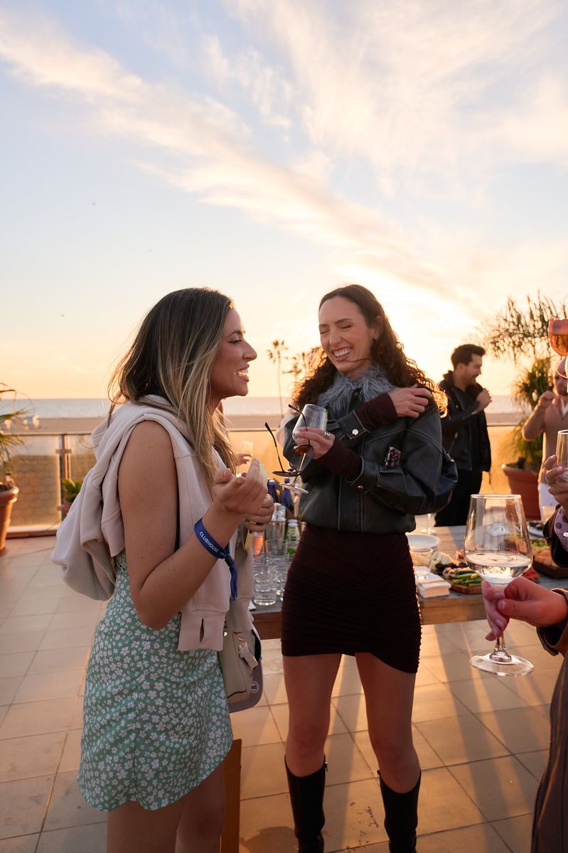 Friends laughing at sunset