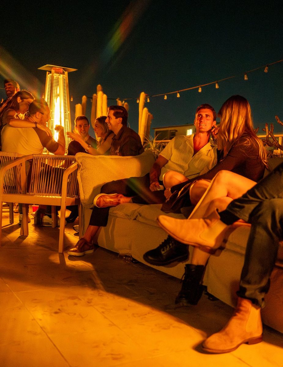 Fire-pit heaters glowing on the rooftop at night
