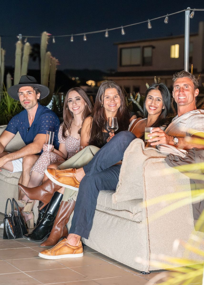 Five guests on the rooftop couch