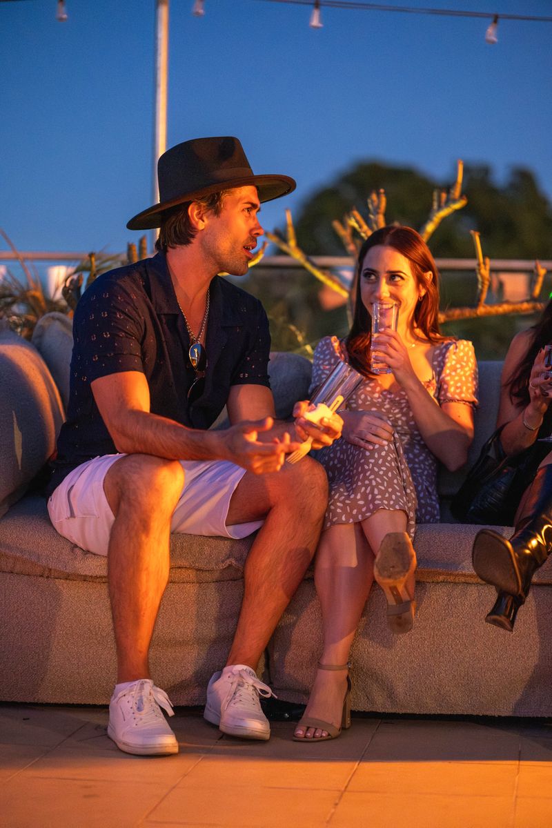 Conversation on the rooftop after dark