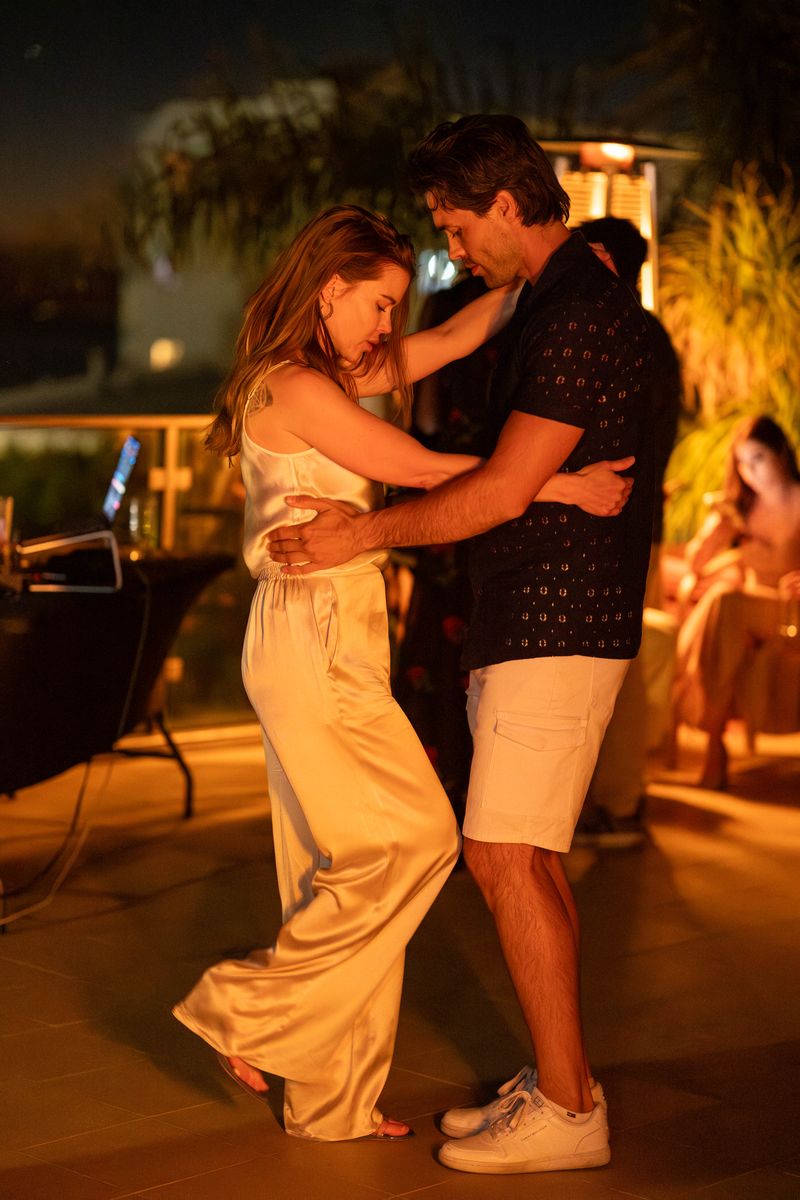 A slow dance under string lights