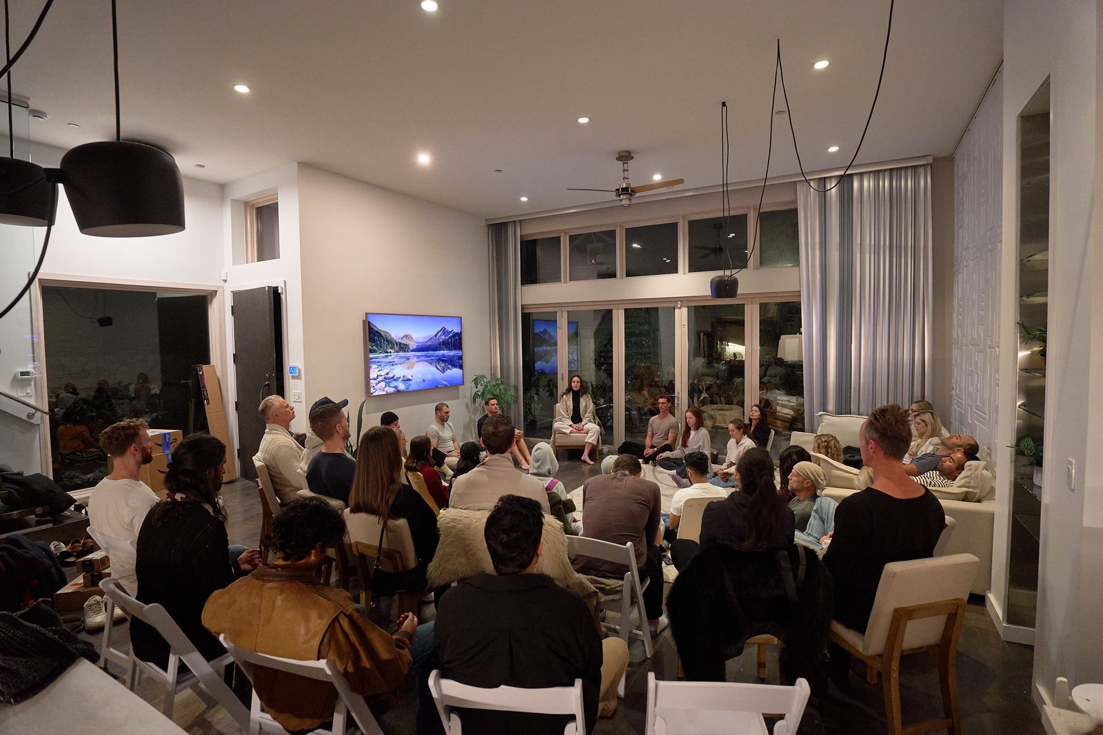 Group seated in the Clubhouse main room for an event